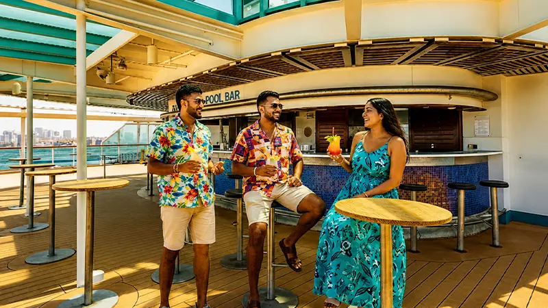 Guests enjoying refreshments at the open-air deck bar on the Cordelia Cruise