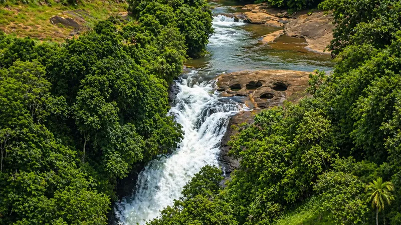 Scenic waterfall near Kerala wellness retreat