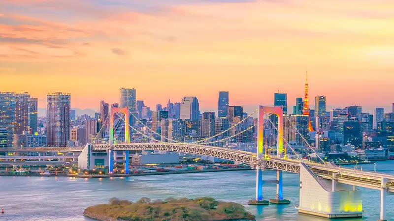 Rainbow Bridge and Tokyo skyline at sunset